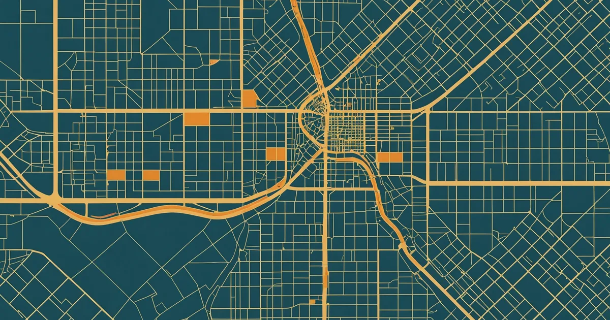 Urban planning map showing zoning layers in teal and amber overlaid on a city grid